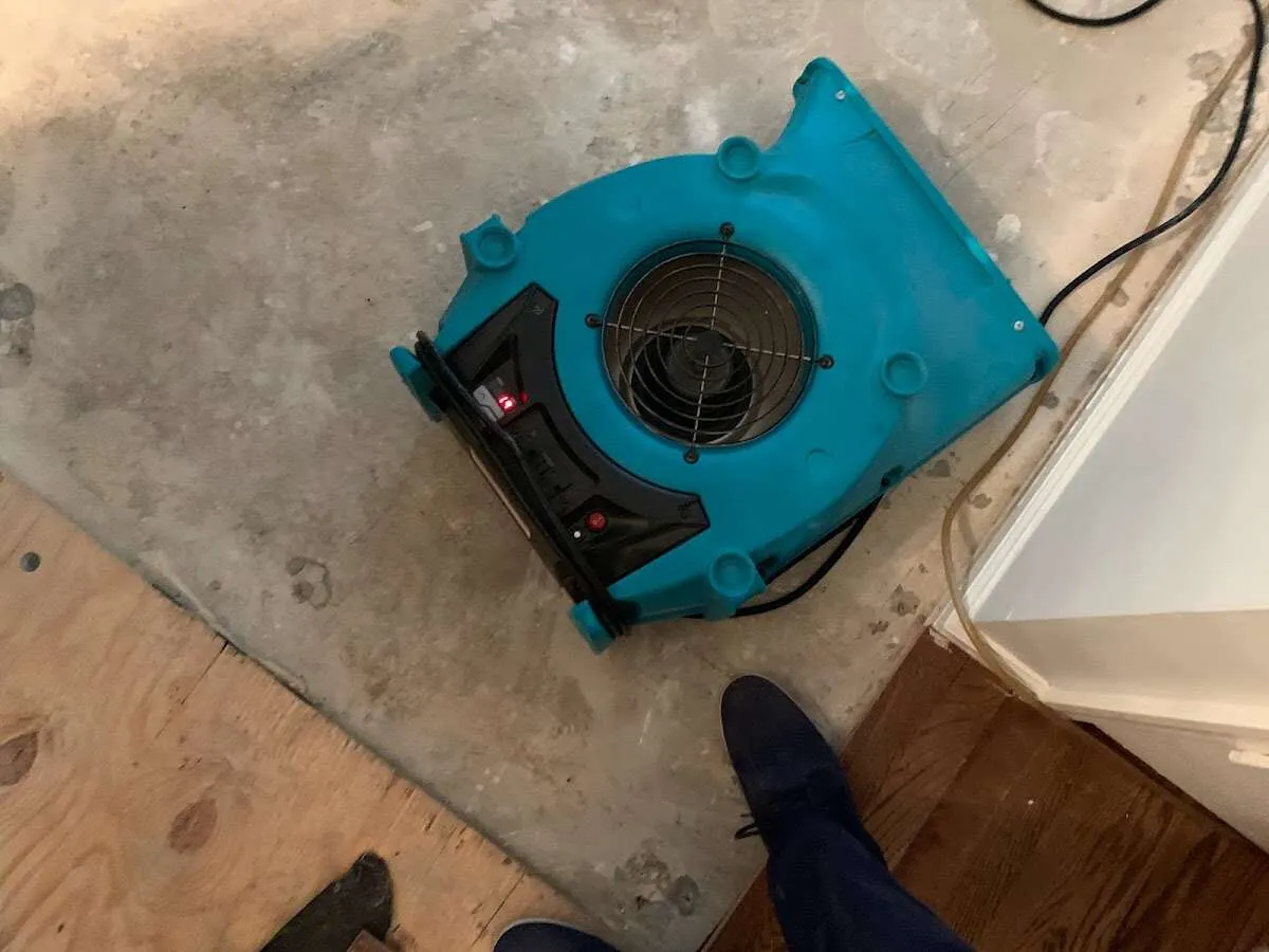 Air mover drying subfloor during Commercial Water Damage Restoration in New Paltz
